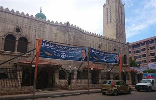 بالصوردعاية الانتخابات بالإسكندرية لافتات فوق المساجدوتماثيل الزعماء تختفي خلف صور المرشحين
